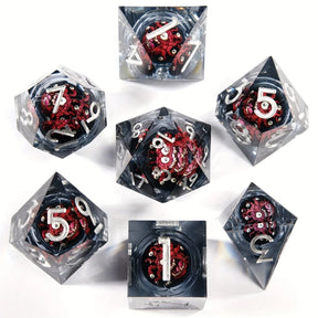 Beholder 7-piece liquid core dice set on white