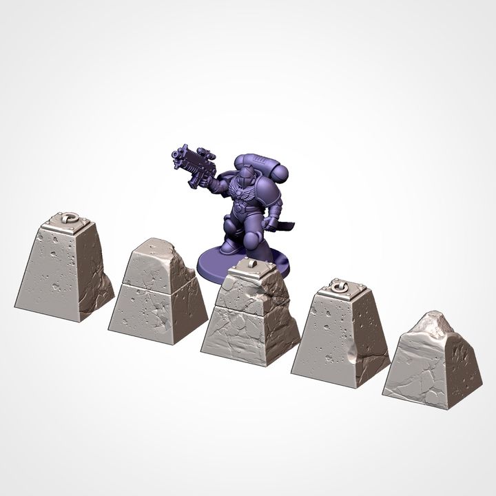 Dragon’s teeth and rubble blocks, shown beside a 32mm miniature for scale